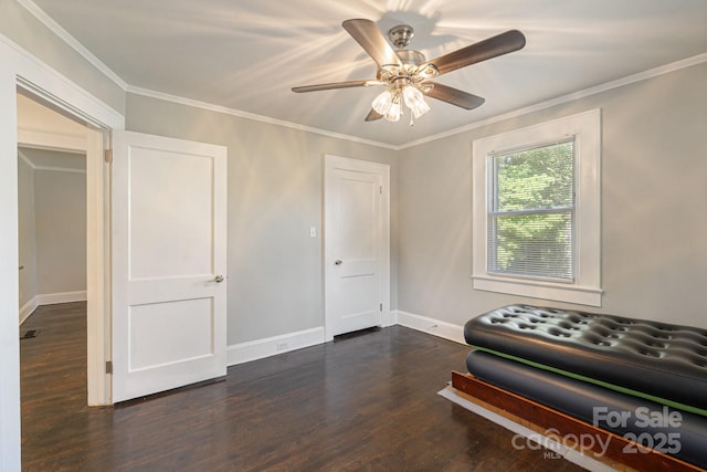 115 E Catawba St, Morganton, NC 28655 - sitting room with dark wood-style flooring, ornamental molding, and ceiling fan