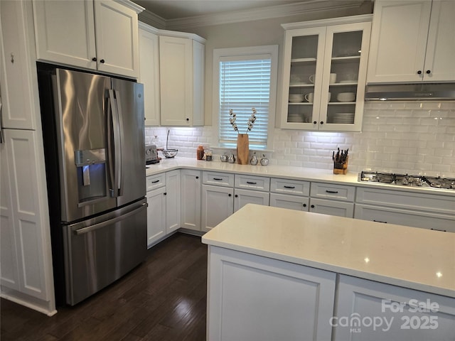 5000 Britannia Blvd, Waxhaw, NC 28173 - kitchen featuring appliances with stainless steel finishes, ornamental molding, white cabinetry, backsplash, and dark wood finished floors