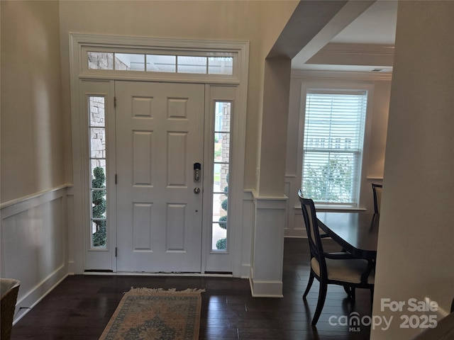 5000 Britannia Blvd, Waxhaw, NC 28173 - foyer entrance with a decorative wall, a wainscoted wall, dark wood finished floors, healthy amount of natural light, and ornamental molding