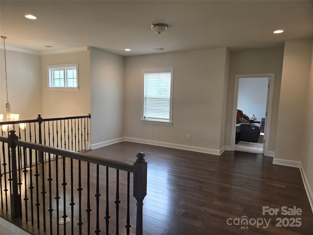 5000 Britannia Blvd, Waxhaw, NC 28173 - empty room featuring dark wood-style floors, a chandelier, baseboards, recessed lighting, and ornamental molding