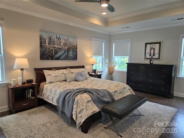 5000 Britannia Blvd, Waxhaw, NC 28173 - bedroom featuring wood finished floors, ornamental molding, a tray ceiling, recessed lighting, and baseboards