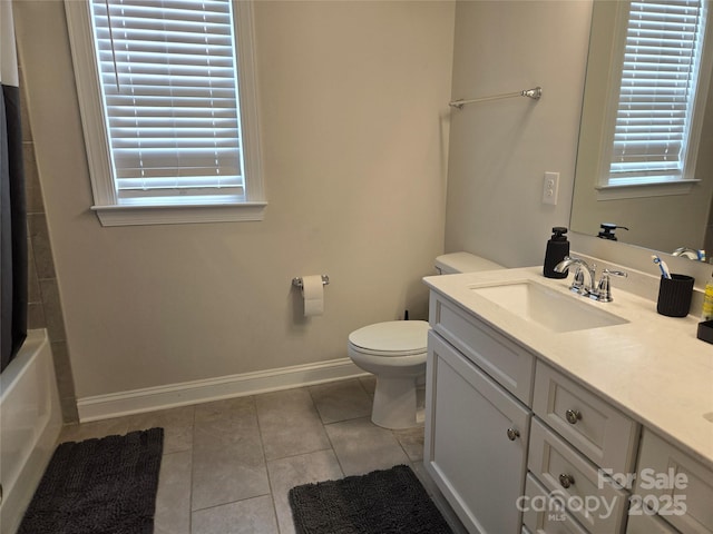 5000 Britannia Blvd, Waxhaw, NC 28173 - full bath with double vanity, baseboards, tile patterned floors, toilet, and shower / bath combo