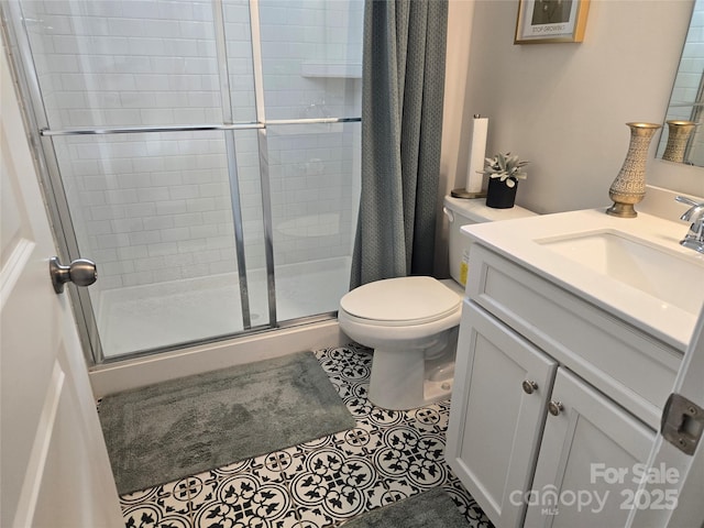 5000 Britannia Blvd, Waxhaw, NC 28173 - full bathroom with vanity, toilet, a stall shower, and tile patterned floors