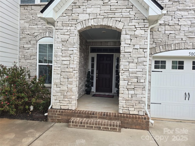 5000 Britannia Blvd, Waxhaw, NC 28173 - view of exterior entry with stone siding and a garage