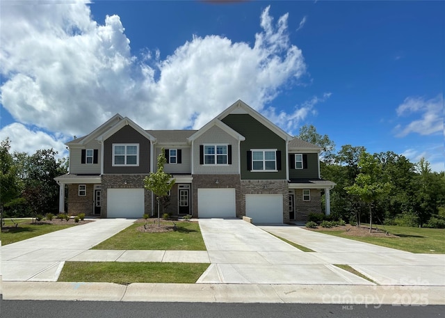 8060 Scarlet Maple Ln, Tega Cay, SC 29708 - view of front of house featuring an attached garage, driveway, and a front yard