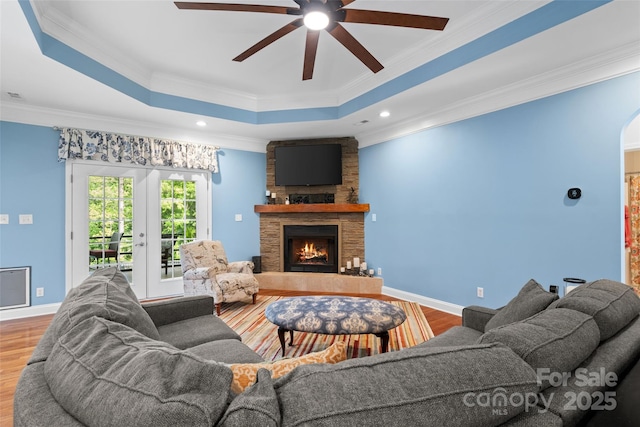 1912 Dawnhurst Ln, York, SC 29745 - living room with wood finished floors, ceiling fan, a fireplace, crown molding, and a raised ceiling