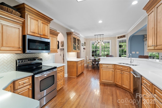 1912 Dawnhurst Ln, York, SC 29745 - kitchen with stainless steel appliances, light countertops, light wood-style floors, decorative backsplash, and recessed lighting