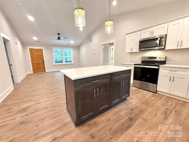 2330 Neill Rd, Lancaster, SC 29720 - kitchen with stainless steel appliances, light countertops, a ceiling fan, lofted ceiling, and white cabinets