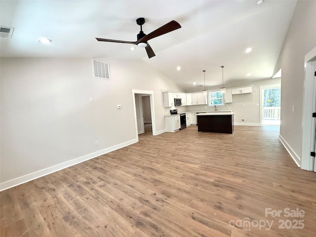 2330 Neill Rd, Lancaster, SC 29720 - unfurnished living room featuring vaulted ceiling, light wood-style flooring, ceiling fan, and recessed lighting