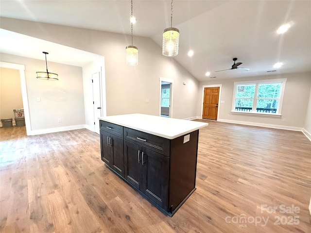 2330 Neill Rd, Lancaster, SC 29720 - kitchen featuring lofted ceiling, light wood-style flooring, ceiling fan, light countertops, and decorative light fixtures