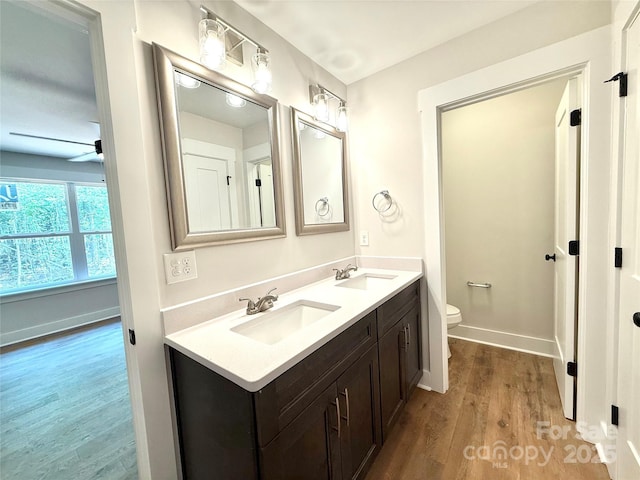 2330 Neill Rd, Lancaster, SC 29720 - full bath featuring wood finished floors, double vanity, and a ceiling fan