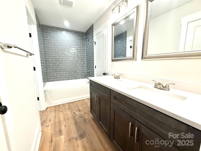 2330 Neill Rd, Lancaster, SC 29720 - bathroom featuring double vanity, wood finished floors, and bathing tub / shower combination