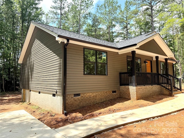 2330 Neill Rd, Lancaster, SC 29720 - view of front of home with crawl space, a porch, and a shingled roof