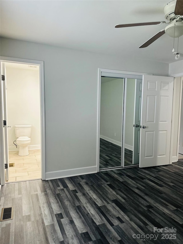 1535 Jordan St, Lancaster, SC 29720 - unfurnished bedroom with wood finished floors, a closet, ceiling fan, and ensuite bath