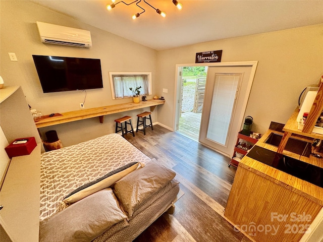 401 Church St, Warrenton, NC 27589 - living room featuring a wall mounted air conditioner, wood finished floors, and vaulted ceiling