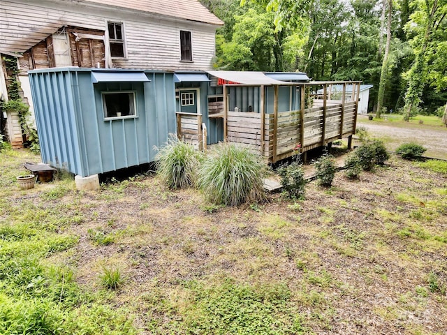 401 Church St, Warrenton, NC 27589 - rear view of property with board and batten siding and an outdoor structure