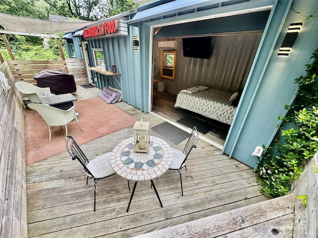 401 Church St, Warrenton, NC 27589 - wooden terrace with an AC wall unit
