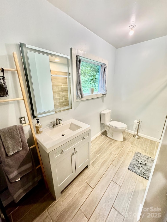401 Church St, Warrenton, NC 27589 - bathroom with wood tiled floors and vanity