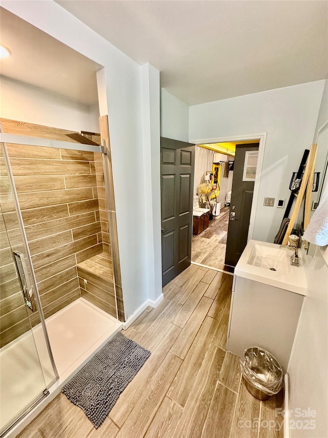 401 Church St, Warrenton, NC 27589 - bathroom with wood finished floors, a stall shower, and vanity