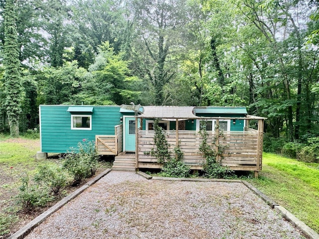 401 Church St, Warrenton, NC 27589 - view of front of house with a deck and a forest view