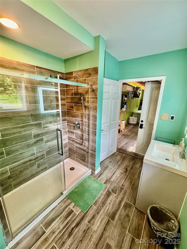 401 Church St, Warrenton, NC 27589 - bathroom with wood finish floors, a shower stall, and vanity