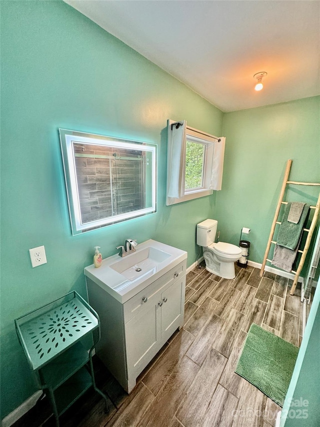 401 Church St, Warrenton, NC 27589 - bathroom featuring wood finish floors and vanity
