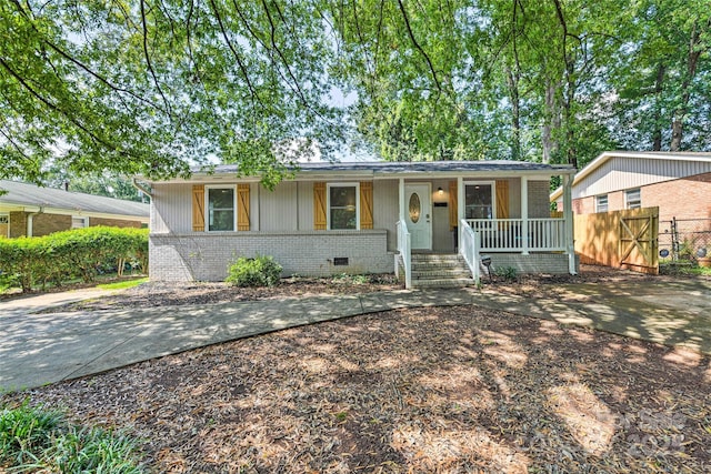 3020 Stancill Pl, Charlotte, NC 28205 - ranch-style home featuring a porch and brick siding