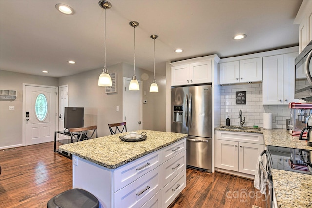 3020 Stancill Pl, Charlotte, NC 28205 - kitchen with stainless steel refrigerator with ice dispenser, a sink, dark wood finished floors, tasteful backsplash, and white cabinets