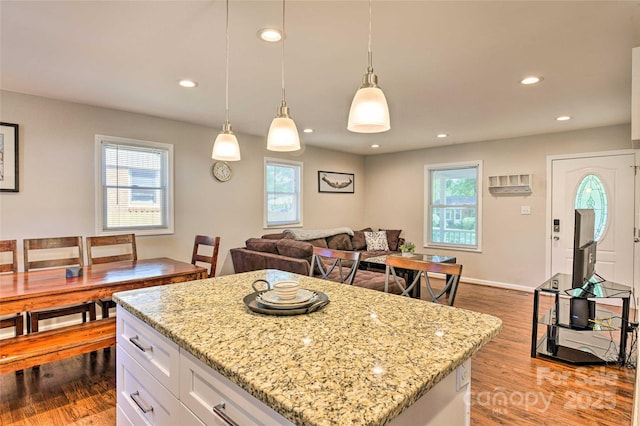 3020 Stancill Pl, Charlotte, NC 28205 - kitchen with healthy amount of natural light, dark wood-type flooring, white cabinets, and recessed lighting
