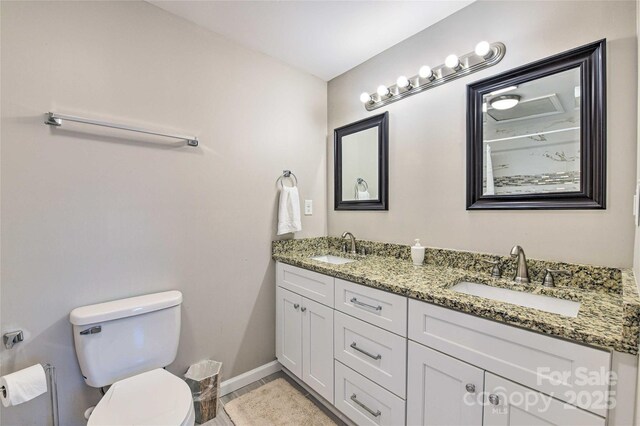 3020 Stancill Pl, Charlotte, NC 28205 - full bath with double vanity, toilet, and baseboards