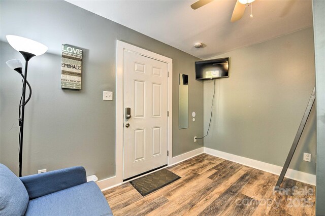 3020 Stancill Pl, Charlotte, NC 28205 - foyer entrance featuring wood finished floors, ceiling fan, and baseboards