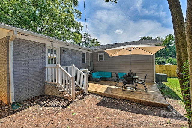 3020 Stancill Pl, Charlotte, NC 28205 - rear view of house featuring brick siding, a deck, and outdoor dining area
