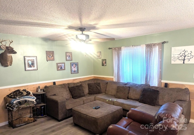 5077 Edney Ct, Granite Falls, NC 28630 - living area with wood finished floors, a textured ceiling, and a ceiling fan