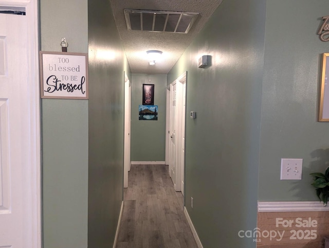 5077 Edney Ct, Granite Falls, NC 28630 - hall featuring a textured ceiling and wood finished floors