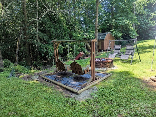 5077 Edney Ct, Granite Falls, NC 28630 - view of green lawn with a fire pit and a storage shed