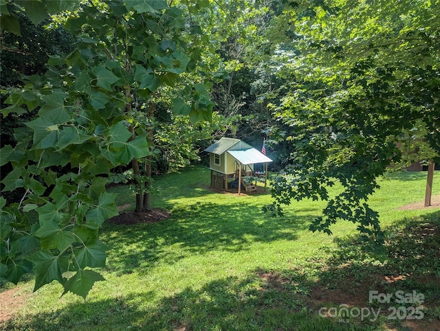 5077 Edney Ct, Granite Falls, NC 28630 - view of green lawn with an outbuilding and exterior structure