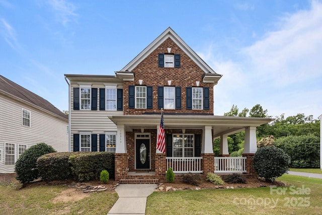 10349 Alvarado Way, Charlotte, NC 28277 - georgian-style home with brick siding, a porch, and a front lawn