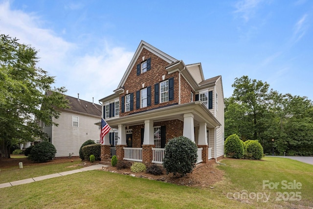 10349 Alvarado Way, Charlotte, NC 28277 - view of front of property with brick siding, covered porch, and a front yard