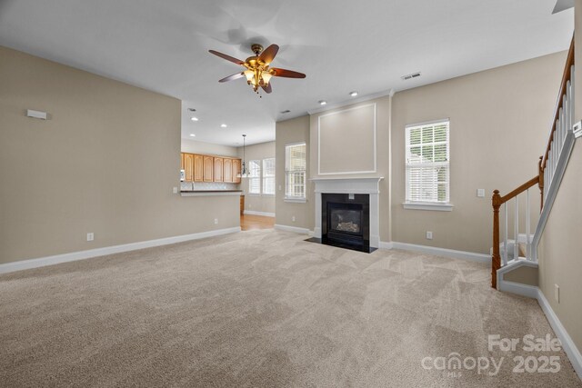 10349 Alvarado Way, Charlotte, NC 28277 - unfurnished living room with a ceiling fan, stairs, recessed lighting, light carpet, and a fireplace with flush hearth