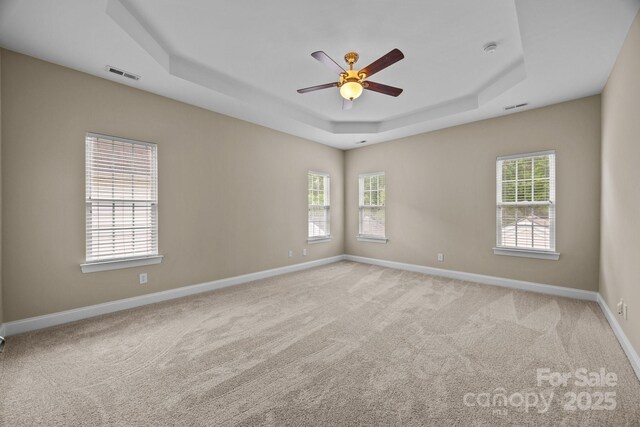 10349 Alvarado Way, Charlotte, NC 28277 - spare room featuring a raised ceiling, plenty of natural light, and light carpet