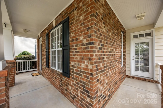 10349 Alvarado Way, Charlotte, NC 28277 - property entrance featuring covered porch and brick siding