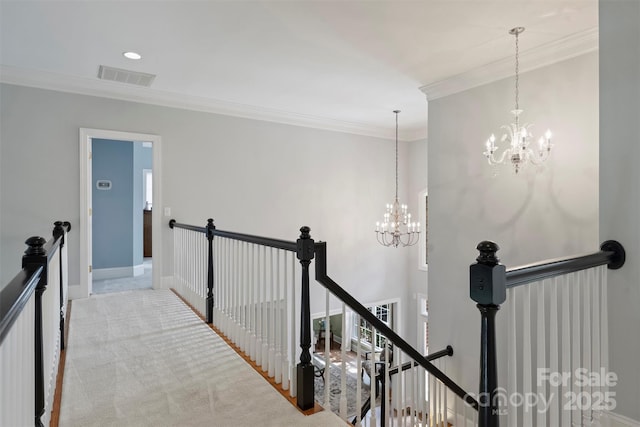 12644 Lahinch Ct, Charlotte, NC 28277 - corridor with an upstairs landing, a chandelier, crown molding, and carpet