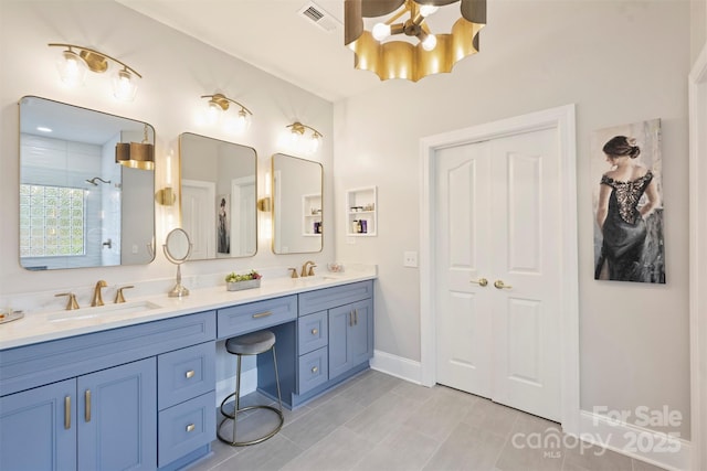 12644 Lahinch Ct, Charlotte, NC 28277 - bathroom featuring a chandelier, double vanity, and a tile shower