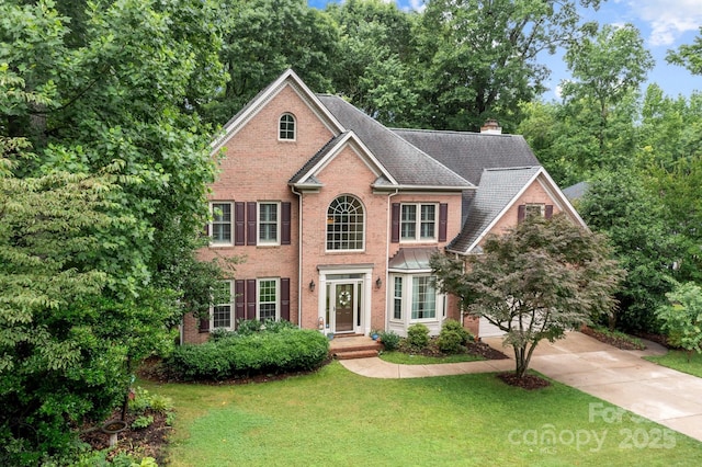 17433 Glassfield Dr, Huntersville, NC 28078 - colonial house featuring brick siding, a front yard, and a chimney