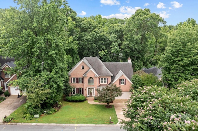 17433 Glassfield Dr, Huntersville, NC 28078 - view of front facade featuring a chimney, driveway, and a front yard