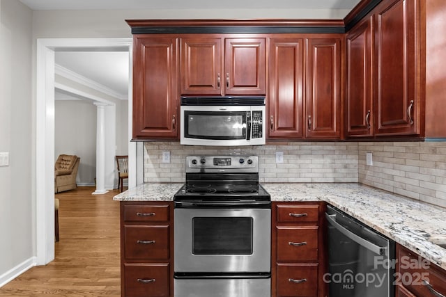 17433 Glassfield Dr, Huntersville, NC 28078 - kitchen featuring appliances with stainless steel finishes, reddish brown cabinets, light wood-style floors, and crown molding