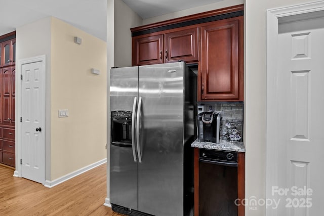 17433 Glassfield Dr, Huntersville, NC 28078 - kitchen featuring stainless steel refrigerator with ice dispenser, light wood finished floors, reddish brown cabinets, light stone countertops, and tasteful backsplash