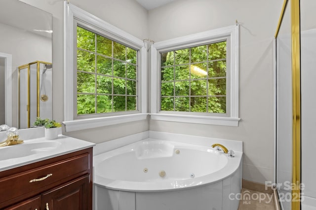 17433 Glassfield Dr, Huntersville, NC 28078 - full bathroom featuring a jetted tub, vanity, and a stall shower