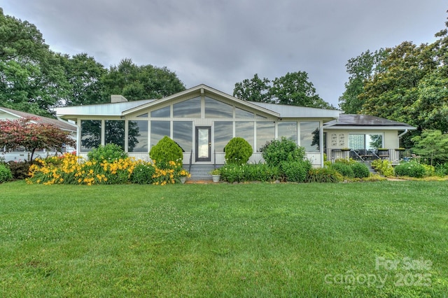7945 Placid Ct, Denver, NC 28037 - manufactured / mobile home featuring a sunroom, a front lawn, and a chimney