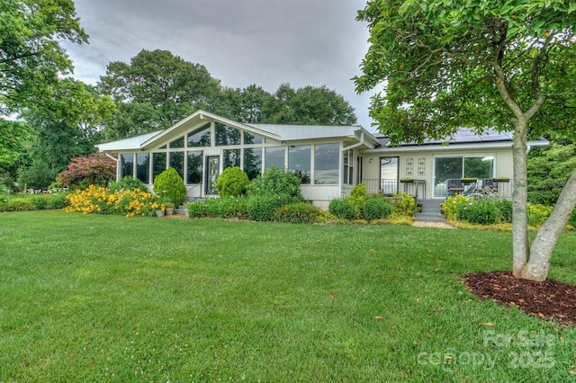 7945 Placid Ct, Denver, NC 28037 - view of front of property with a sunroom and a front lawn